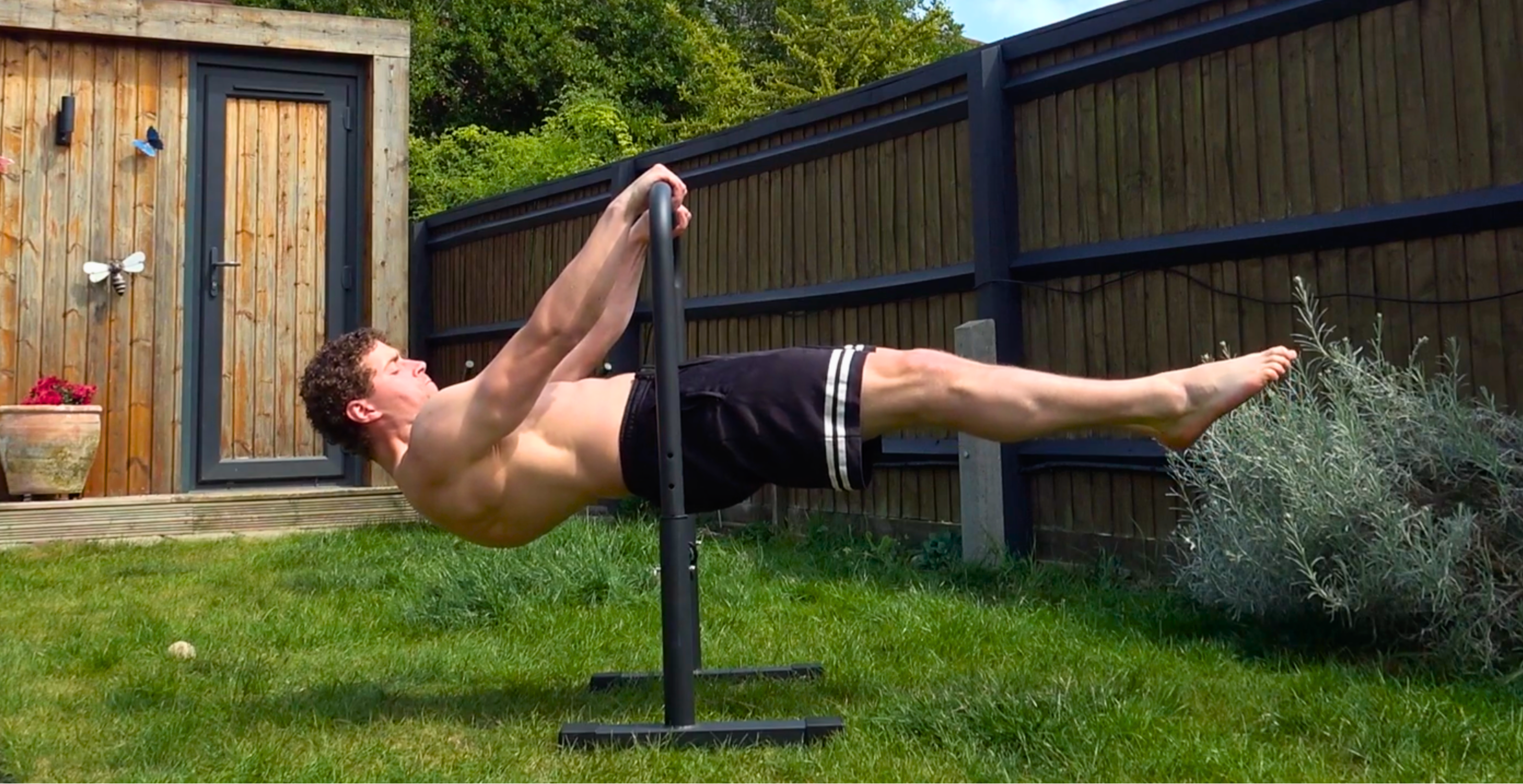 Athletes training on bars in a UK outdoor calisthenics park — Calisthenics HQ guide.